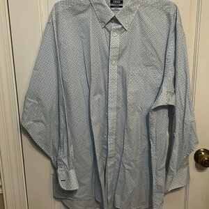 Izod men’s long sleeve button up shirt with teal and purple fish print.  Size XL